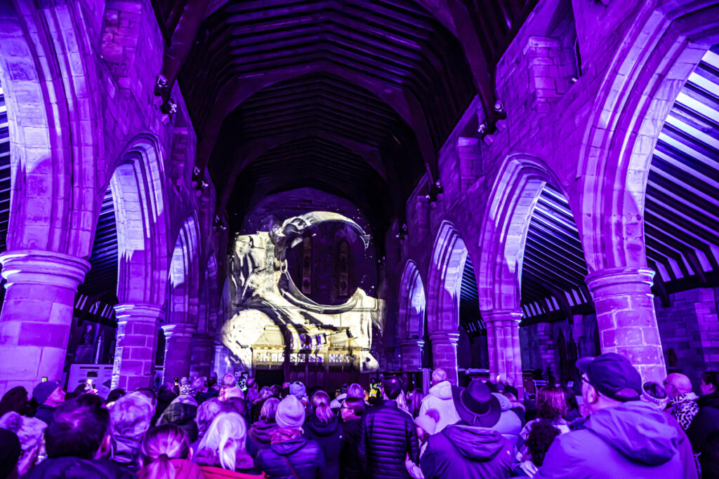 Created with the support of Cumberland Council’s destination management team, the event was part of a new programme of events called ‘The Light District’, curated by the council’s Discover Carlisle team. ‘Space – God, The Universe and Everything’ by Luxmuralis took people on a walking journey through St Bees Priory, revealing the universe, galaxies, space, creation, and light through a variety of sound and light installations transforming the Priory. Thousands travelled from miles around to witness this unique and spectacular immersive artwork in this beautiful historic coastal setting.